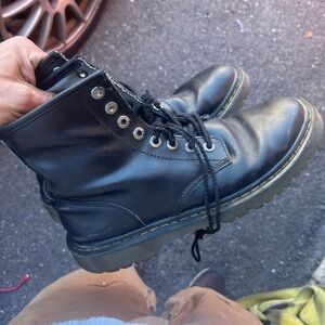Damaged doc marten boots.